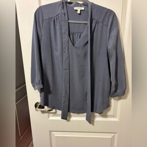 Elegant light blue/gray satin blouse.
